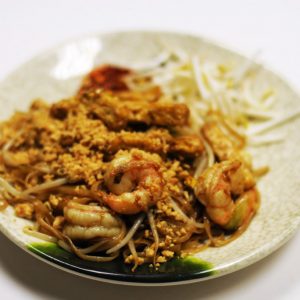 Shrimp Pad Thai (Spicy) Stir-fried rice noodles with tofu, shrimp, egg, & bean sprouts topped with peanuts