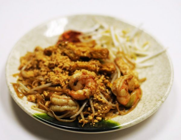 Shrimp Pad Thai (Spicy) Stir-fried rice noodles with tofu, shrimp, egg, & bean sprouts topped with peanuts